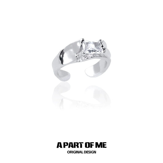 A PART OF ME cracked texture silver ring featuring a unique design and a shining stone accent