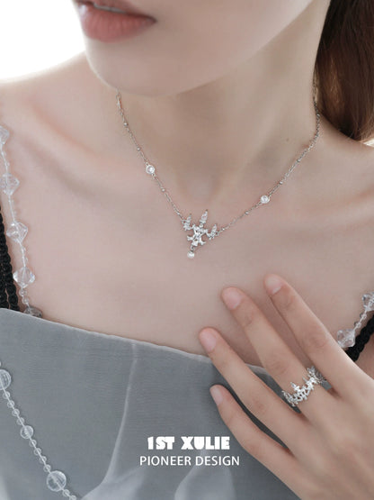 Elegant crystal lamp silver necklace from 1ST XULIE showcasing a stunning design with sparkling crystals.