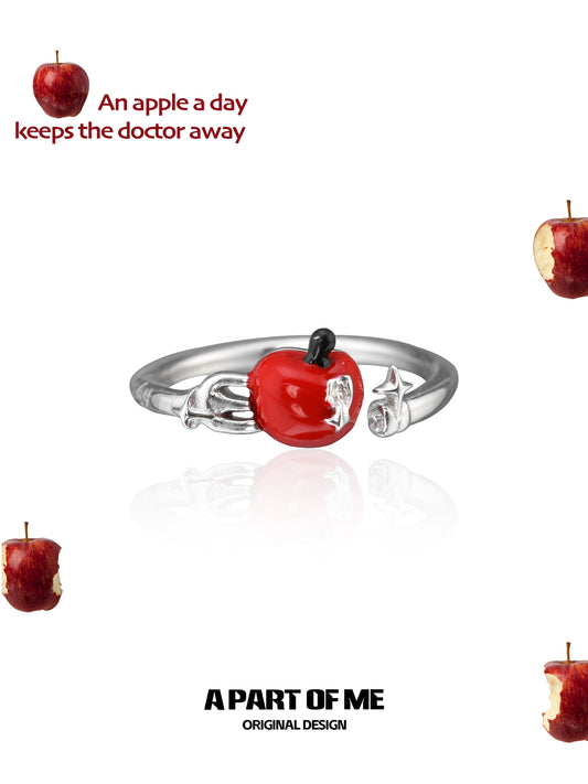 Cute apple ring with a shiny red apple charm on a silver band, ideal for fruit lovers