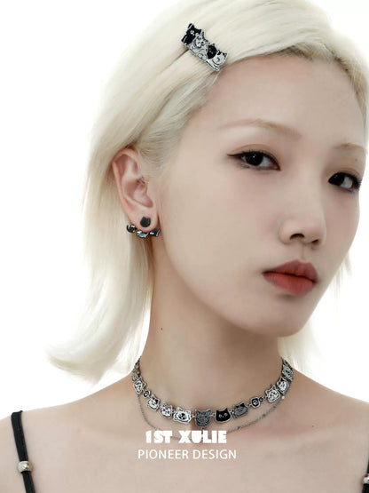 Model wearing cute cat earrings removable with matching choker and hair clip accessories