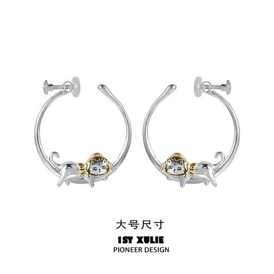 Cute cat hoop earrings featuring a playful cat design in silver and gold tones