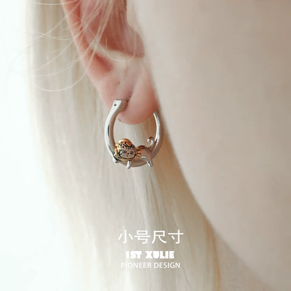 Cute cat hoop earrings by 1STXULIE featuring a charming cat design on a silver hoop