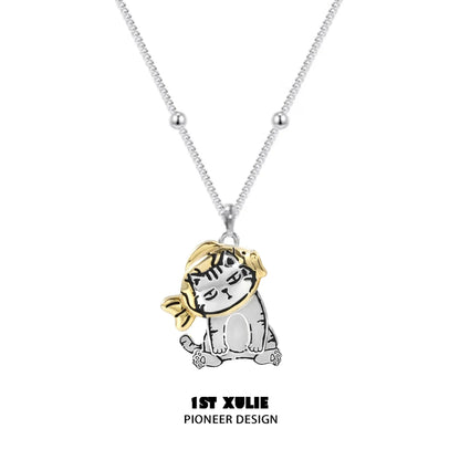 Cute cat necklace by 1STXULIE featuring a playful cat design with a stylish golden scarf