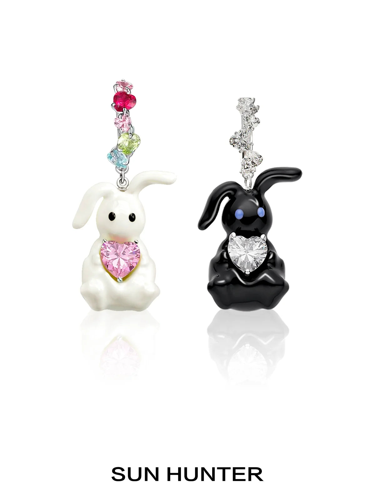 Cute enamel rabbit earrings featuring black and white bunnies with colorful heart details