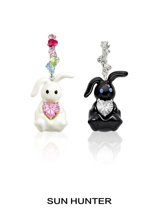 Cute enamel rabbit earrings featuring black and white bunnies with colorful heart details