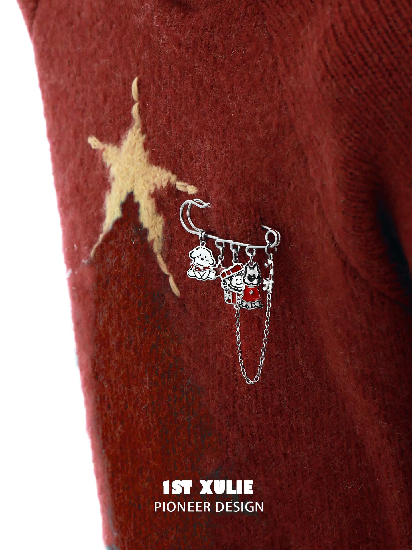Cute puppy brooch pin with adorable charms on a cozy red sweater
