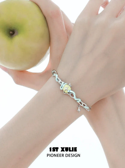 Cute snake apple bracelet with a silver snake design and apple charm, perfect for stylish accessories