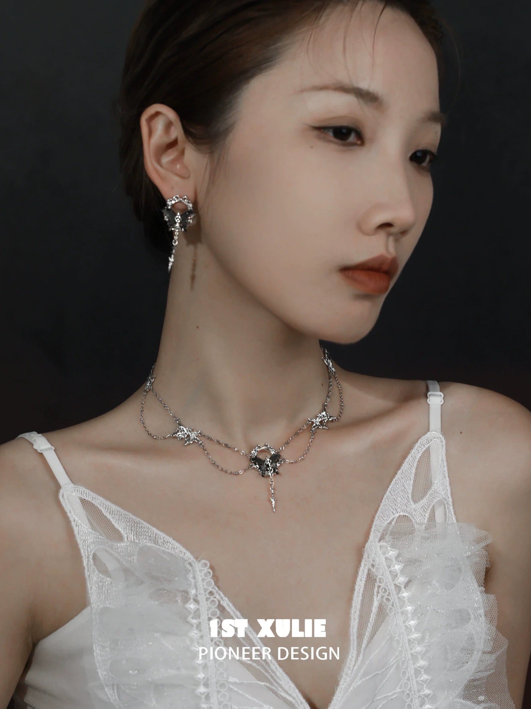 Stylish model wearing cyber butterfly earrings with intricate designs, perfect for fashion-forward outfits