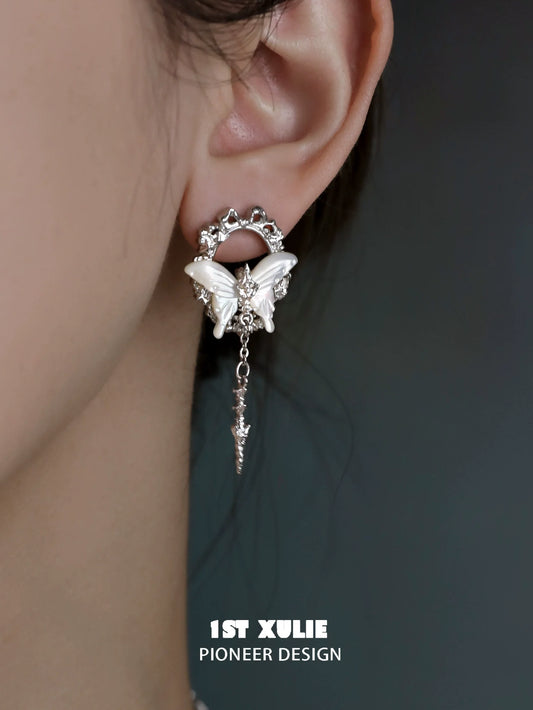 Elegant 1ST XULIE cyber butterfly earrings with intricate design and dangling charms