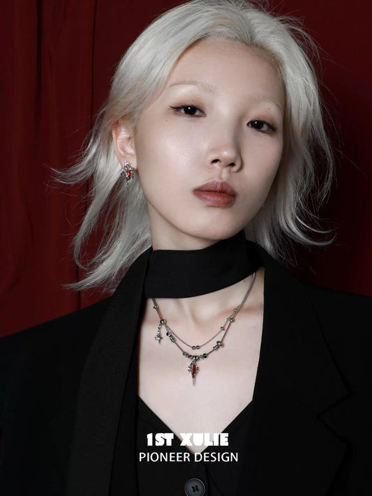 Elegant model showcasing a dark dreamcore necklace with intricate design and layered chains