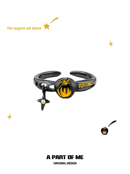 A PART OF ME dark gold apple ring with a unique black design and colorful accents
