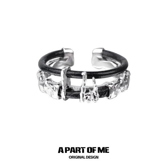 A PART OF ME dark matter leather ring featuring a unique textured design and adjustable fit