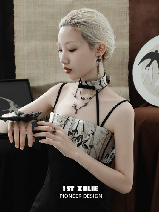 Elegant model wearing dark swallow necklace with a stylish outfit and accessories for a modern look