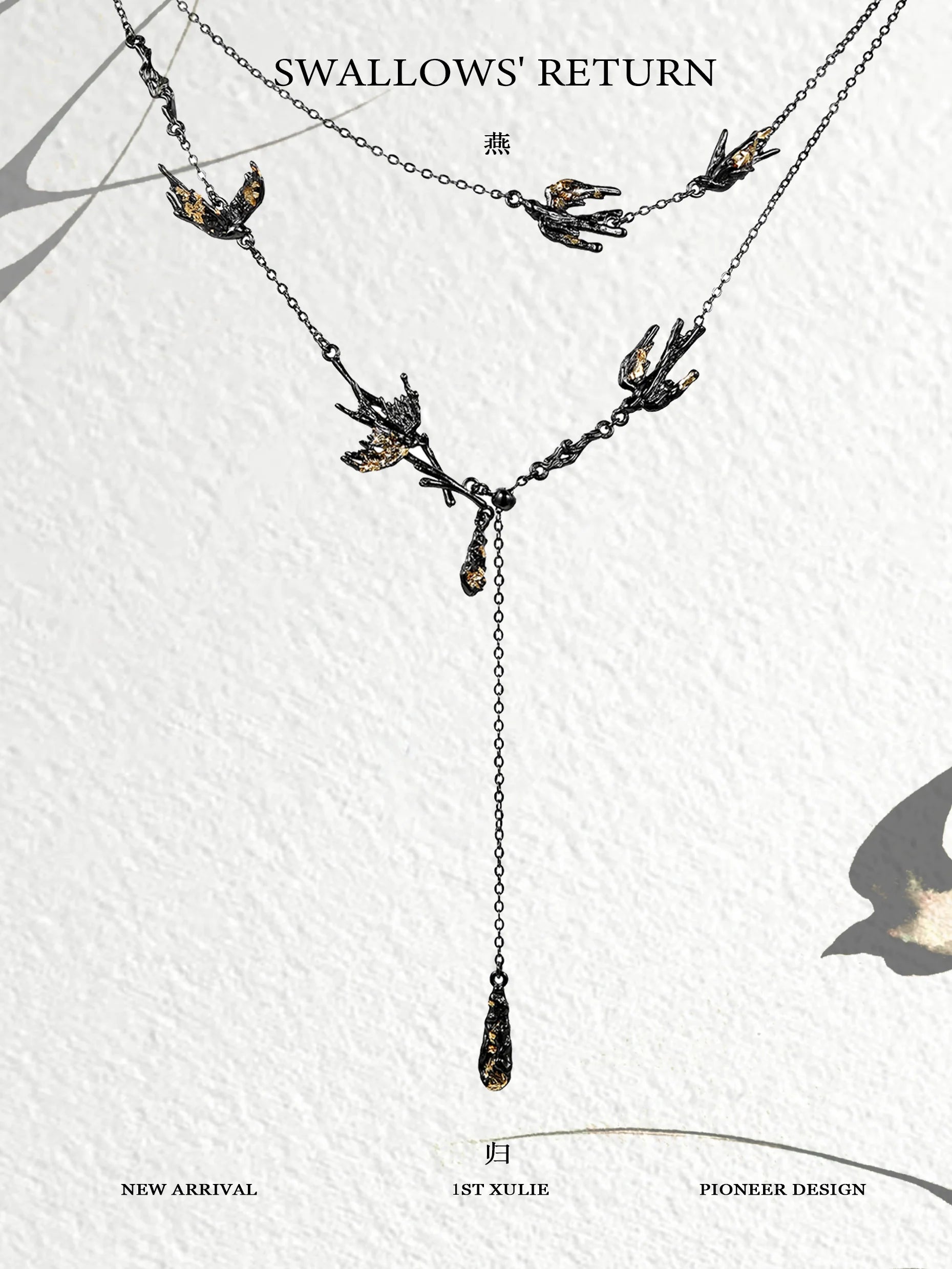 Dark swallow necklace featuring elegant design with multiple swallows and a hanging drop detail