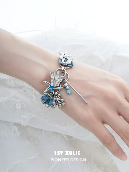 Denim star choker necklace featuring a unique design with silver accents and floral details