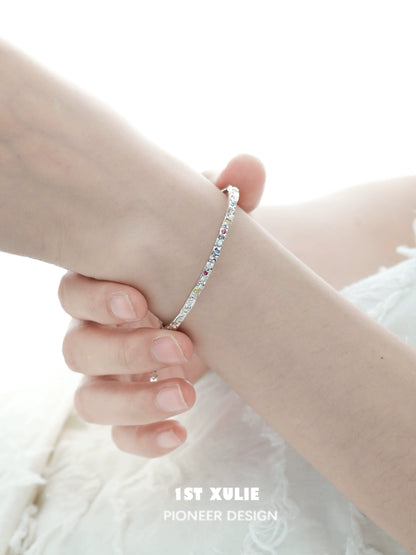 Elegant dopamine color zircon bracelet on a delicate wrist showcasing colorful sparkle