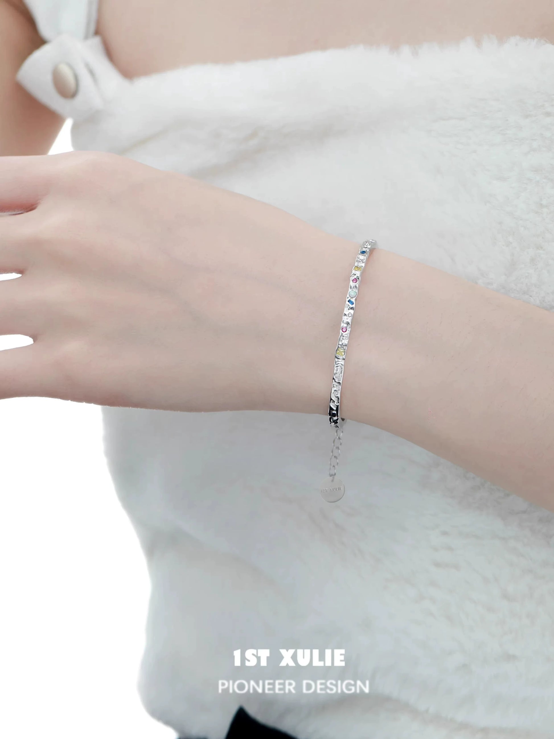 Elegant dopamine color zircon bracelet on a wrist, featuring a sparkling design for stylish occasions