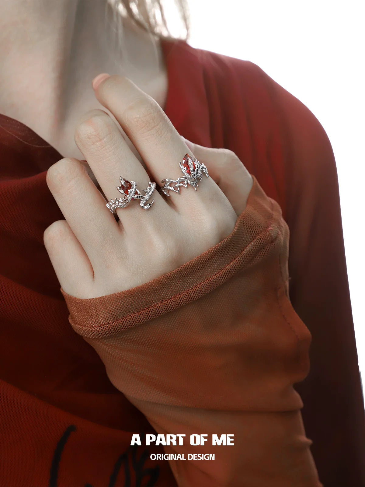 A Part of Me dragon claw ruby ring showcased on model's hand with elegant styling