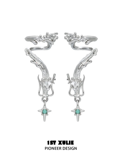 Silver dragon ear cuff jewelry featuring intricate design and turquoise accents for a unique look