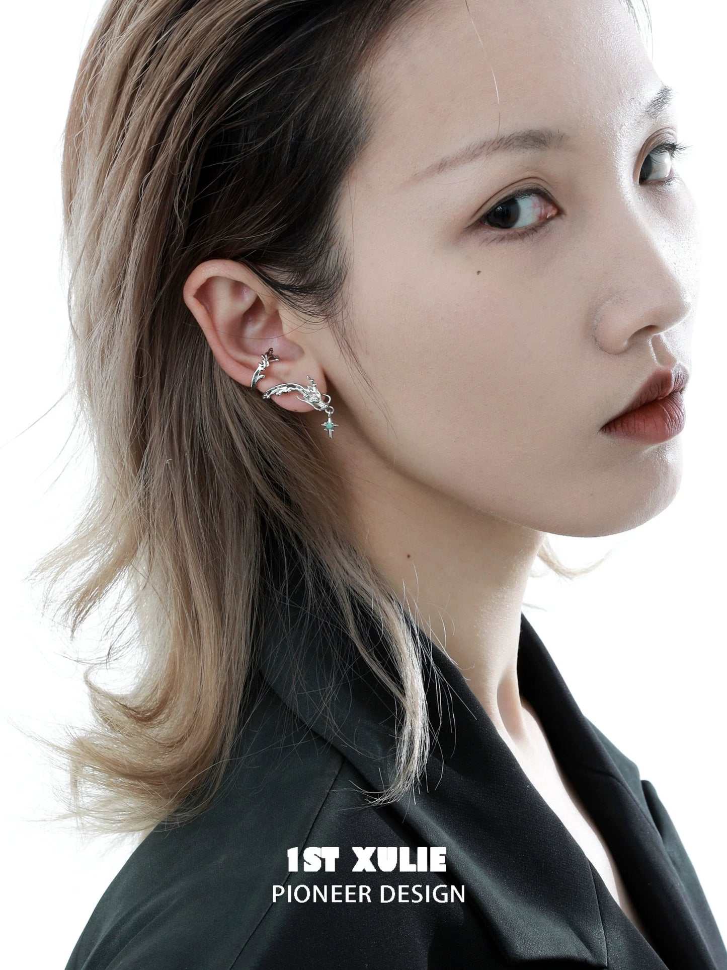 Model wearing 1ST XULIE dragon ear cuff jewelry with unique design and elegant details