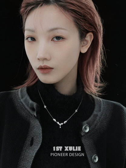 Model wearing an edgy zircon necklace from 1STXULIE with a stylish black outfit