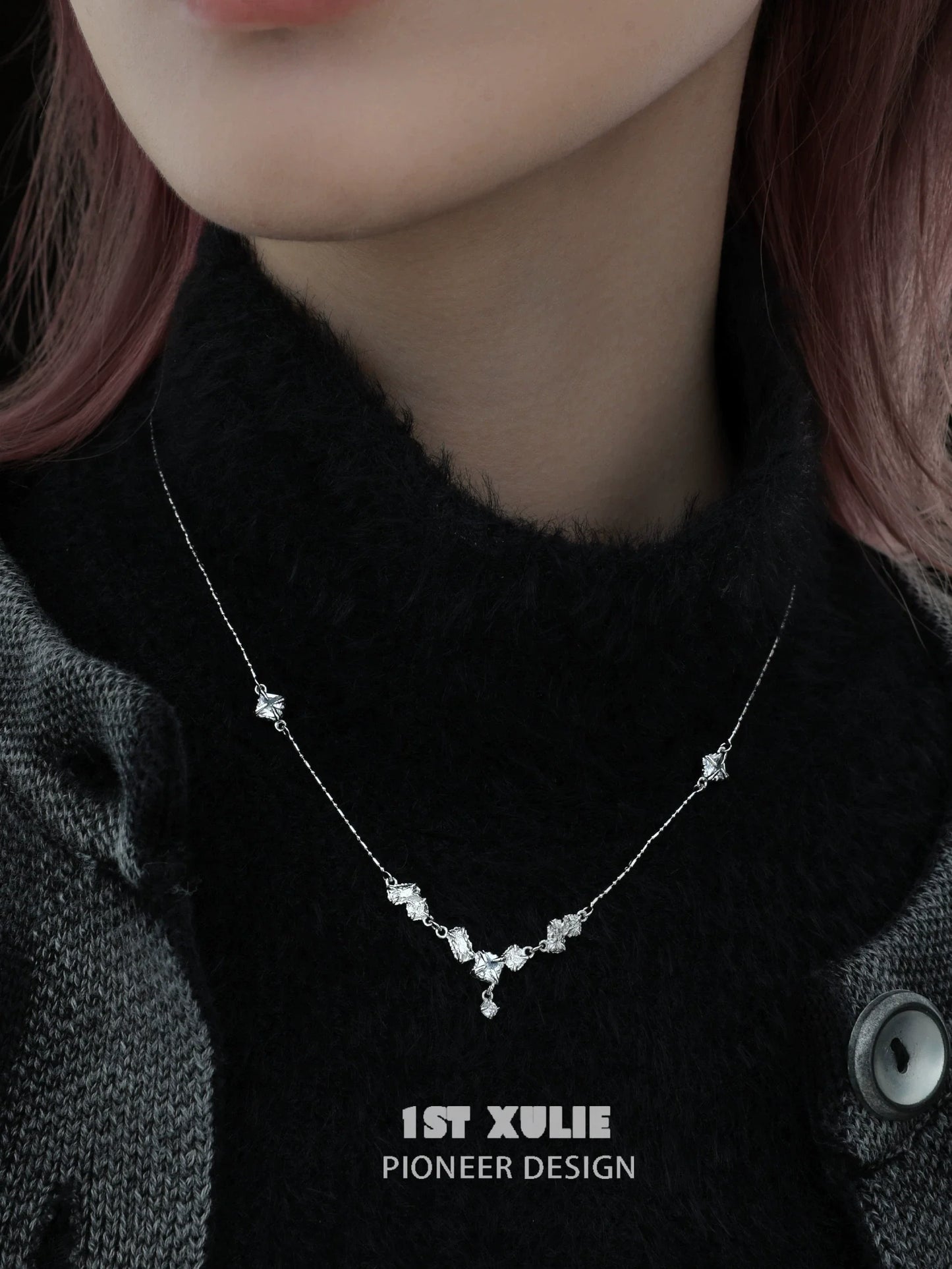 Edgy zircon necklace on a model, featuring a unique design with sparkling stones for a modern look