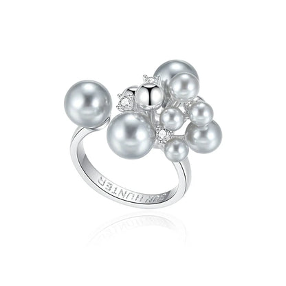 SUN HUNTER elegant pearl statement ring featuring multiple lustrous pearls and sparkling accents