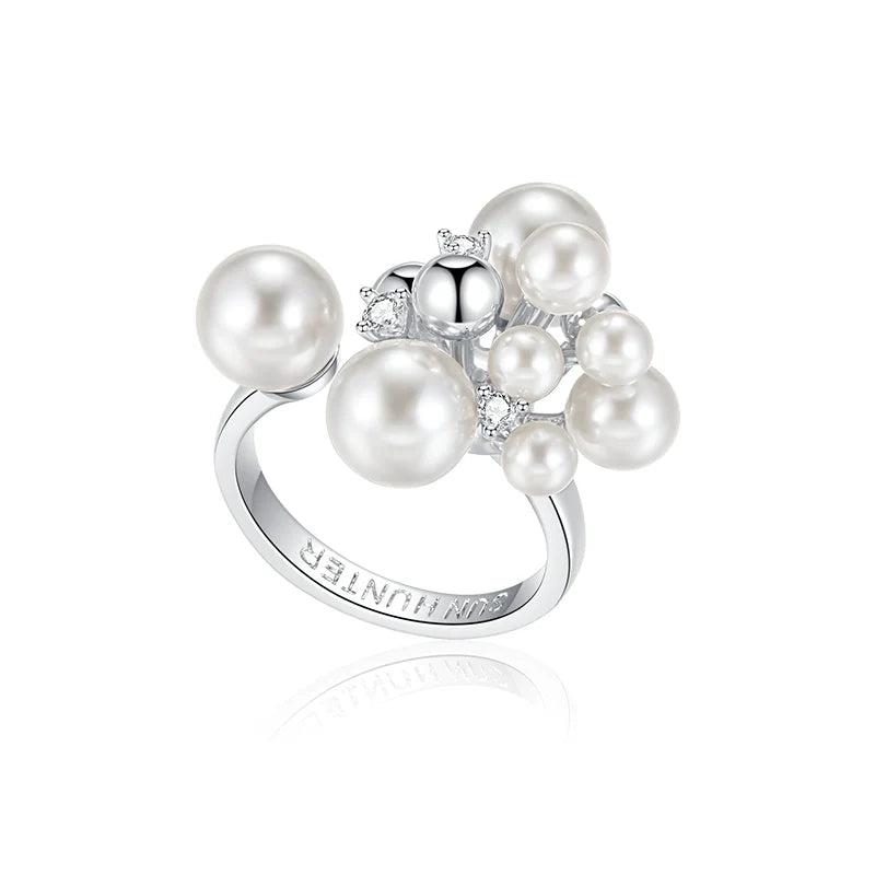 Elegant pearl statement ring with multiple pearls and sparkling accents for a sophisticated look