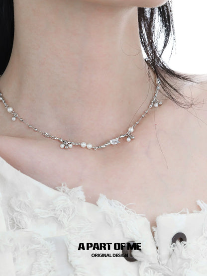Elegant pearl zircon necklace displayed on a model, featuring a modern design with shimmering elements