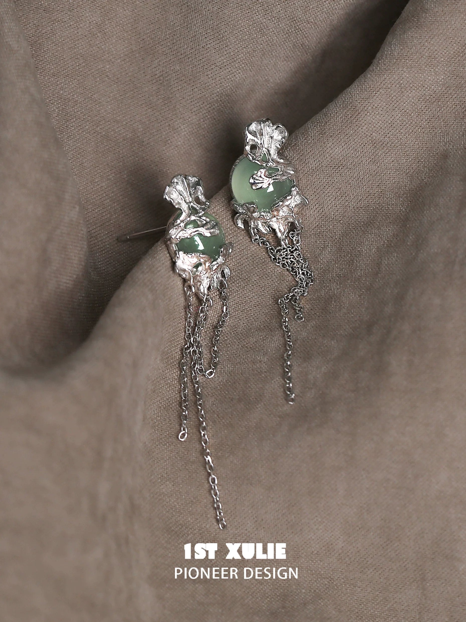 Elegant queen fringe earrings featuring intricate design and silver detailing, suitable for special occasions