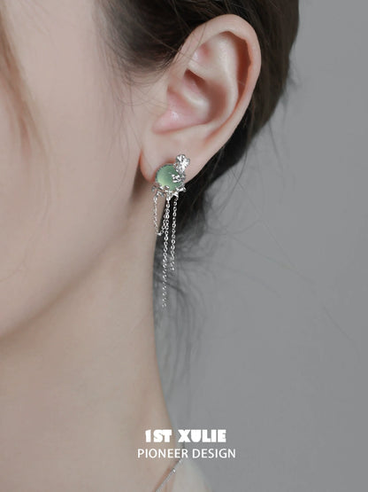 Elegant queen fringe earrings with sparkling accents and delicate chain details for a chic look