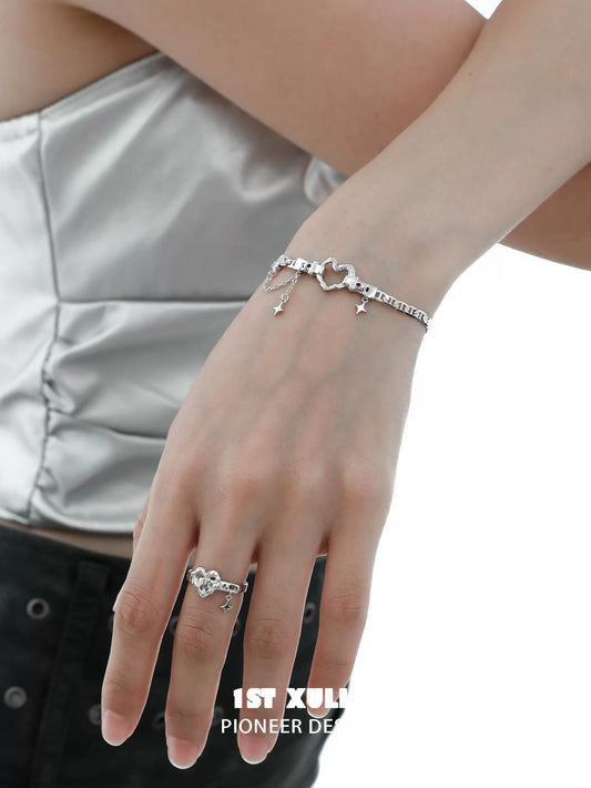 Eternal love heart silver bracelet displayed on a model's wrist with a delicate design