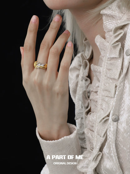 Elegant feather agate ring showcased on a model's hand against a dark background
