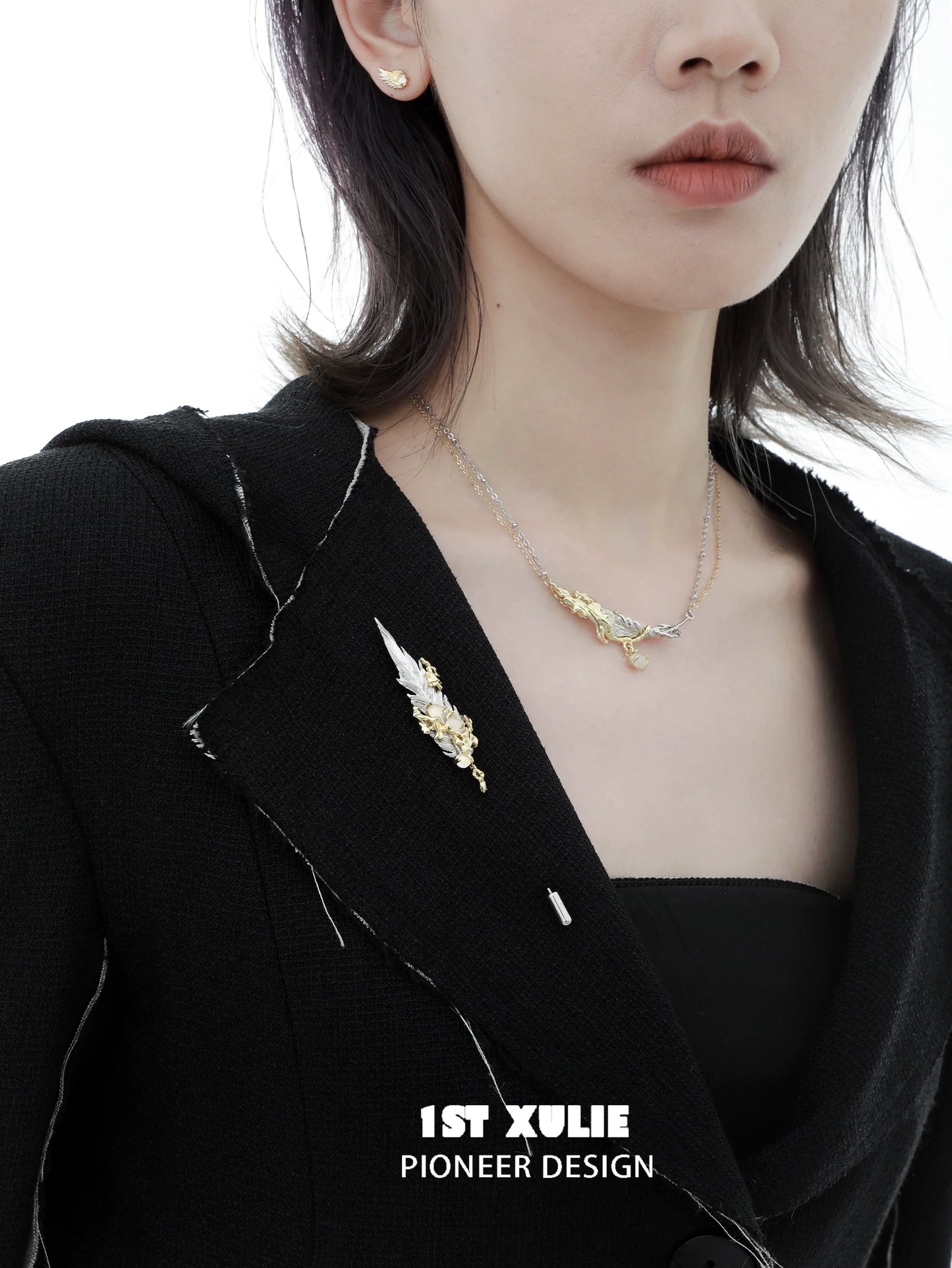 Elegant 1ST XULIE feather couple brooch displayed on a black blazer for a stylish accessory look