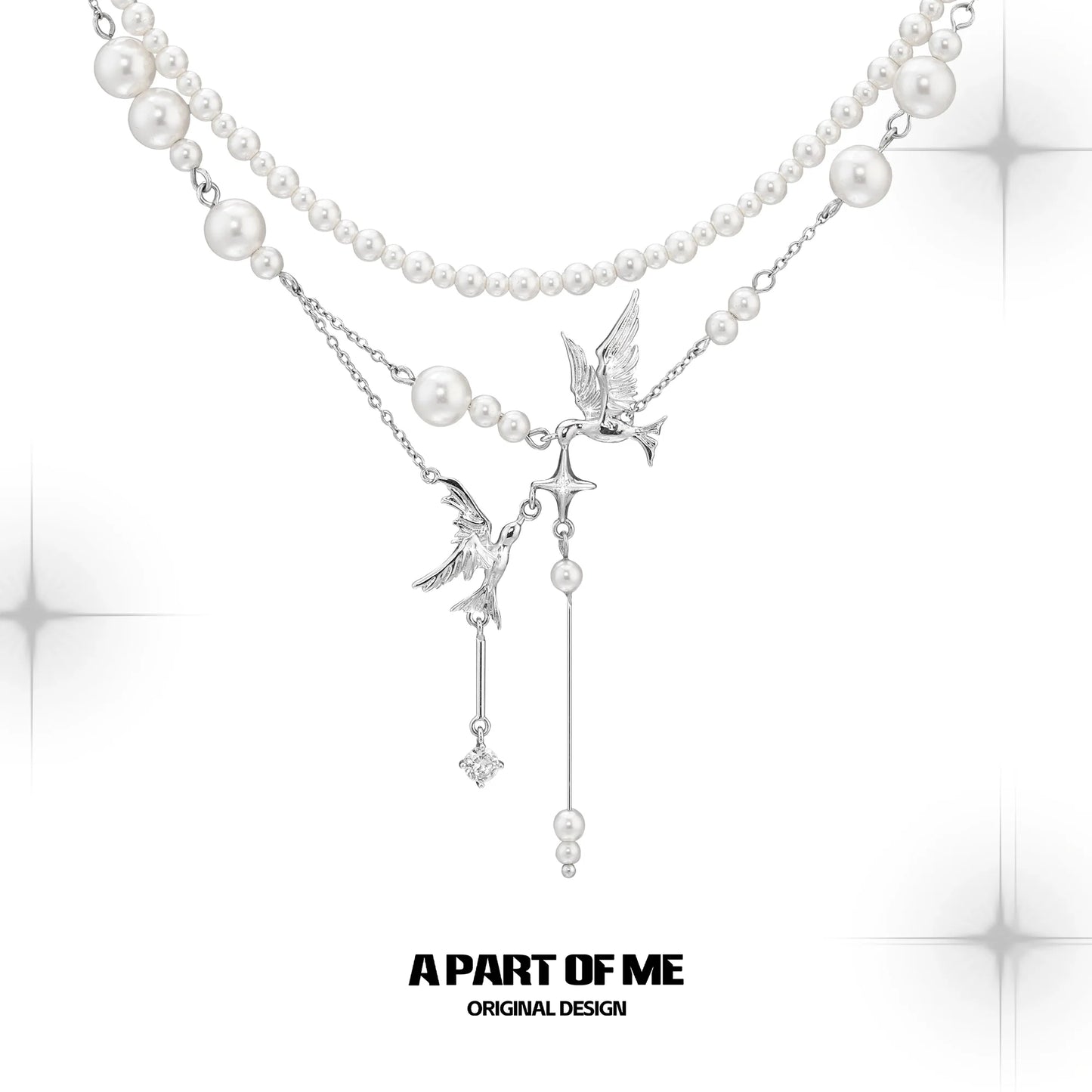 A PART OF ME flying bird pearl necklace featuring elegant bird charms and lustrous pearls