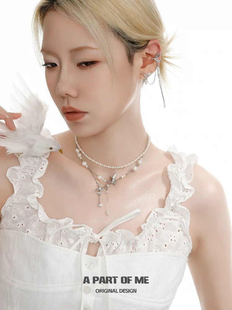 A stylish flying bird pearl necklace featuring delicate pearls and a charming bird pendant