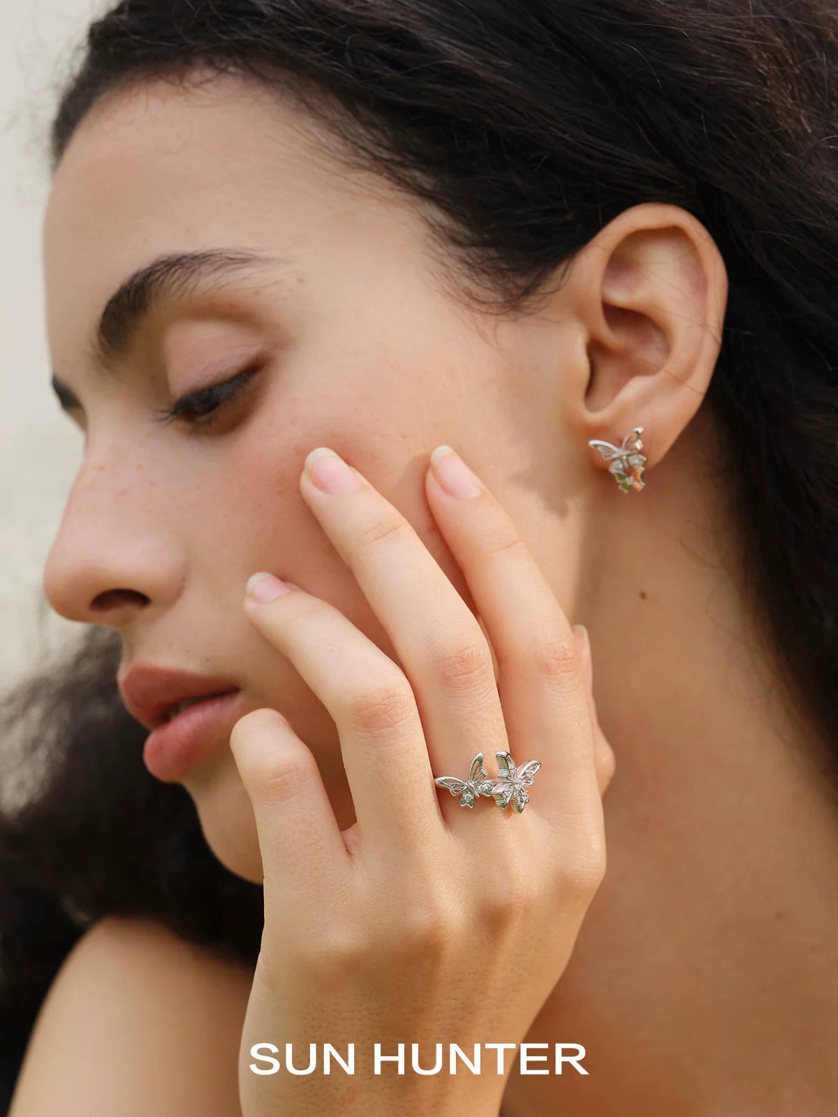 Elegant SUN HUNTER French retro butterfly ring worn on a model's hand, showcasing intricate design