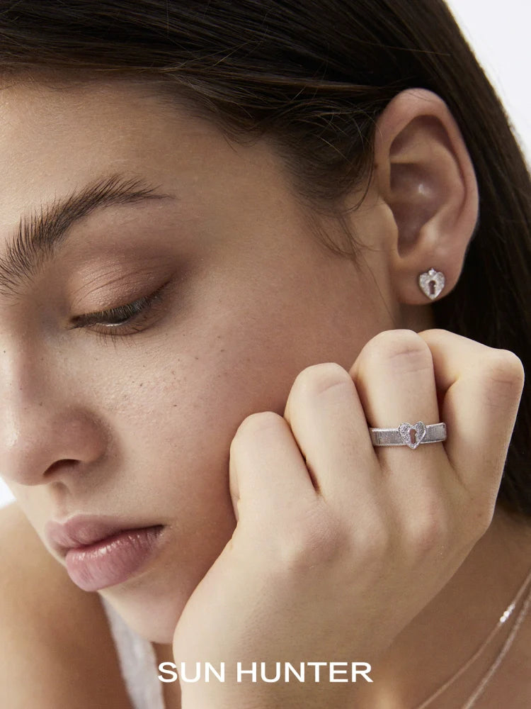Sun Hunter French retro lock ring worn by a model, showcasing its elegant design and craftsmanship