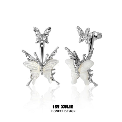 Futuristic butterfly earrings in silver with intricate design and detailed wings for a trendy look