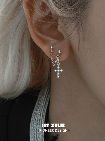 Stylish futuristic cross chain earrings featuring silver chains and sparkling embellishments