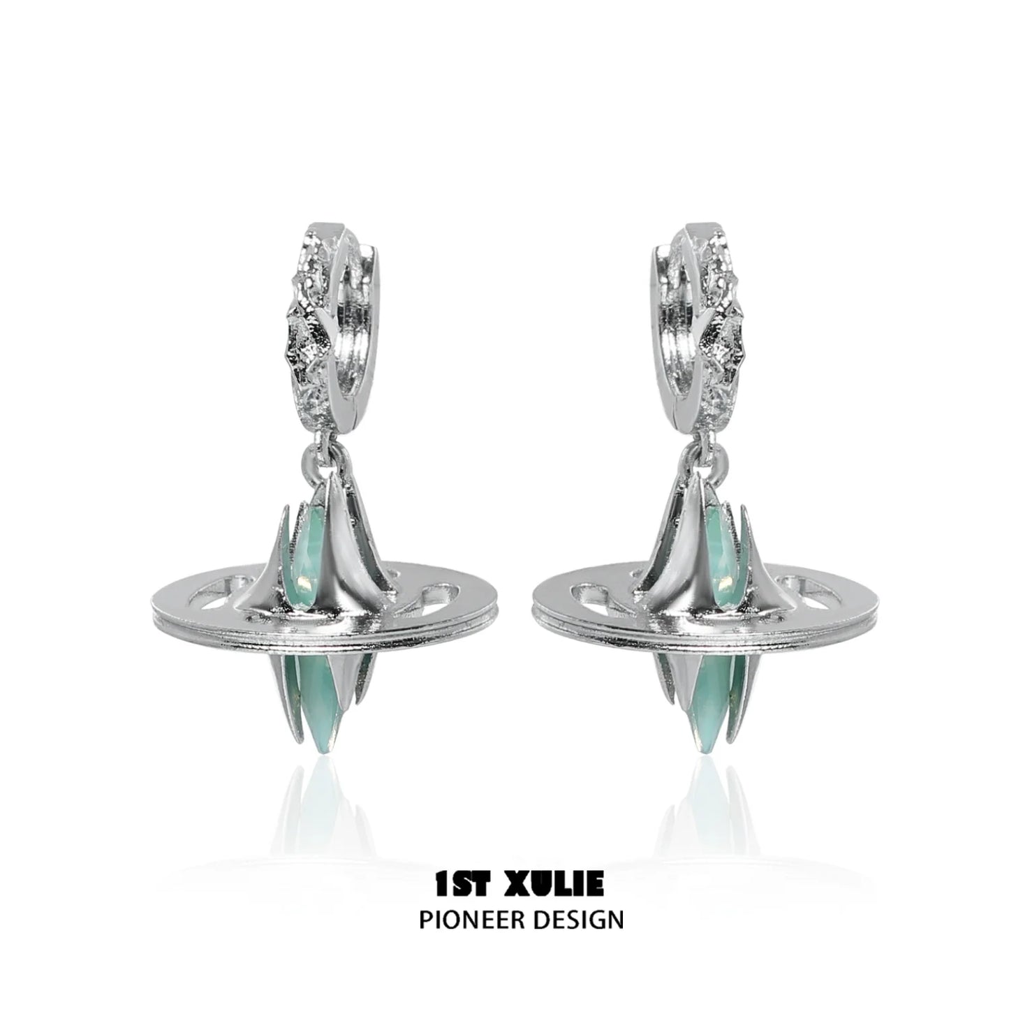 Futuristic dream core earrings by 1ST XULIE featuring silver design and teal accents