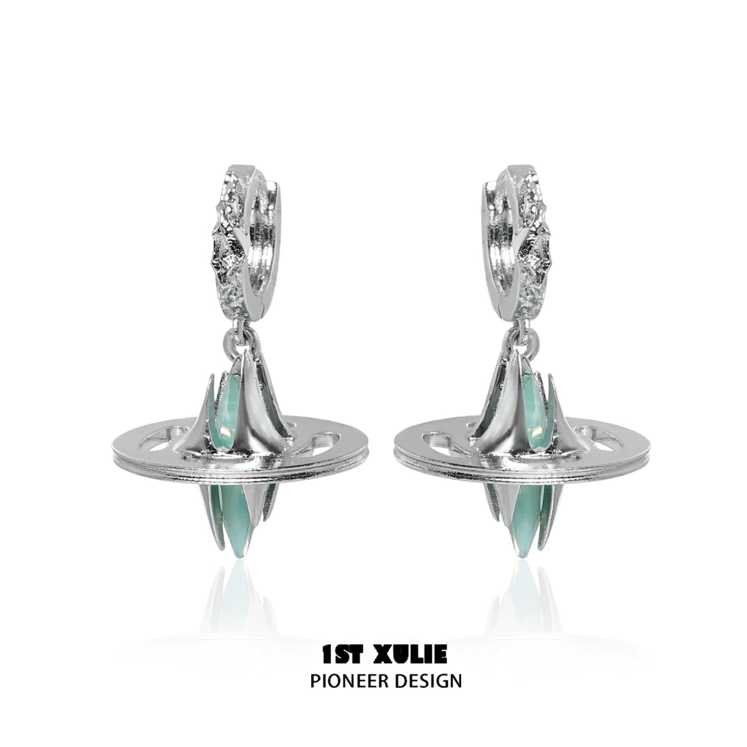 Futuristic dream core earrings by 1ST XULIE featuring silver design and teal accents