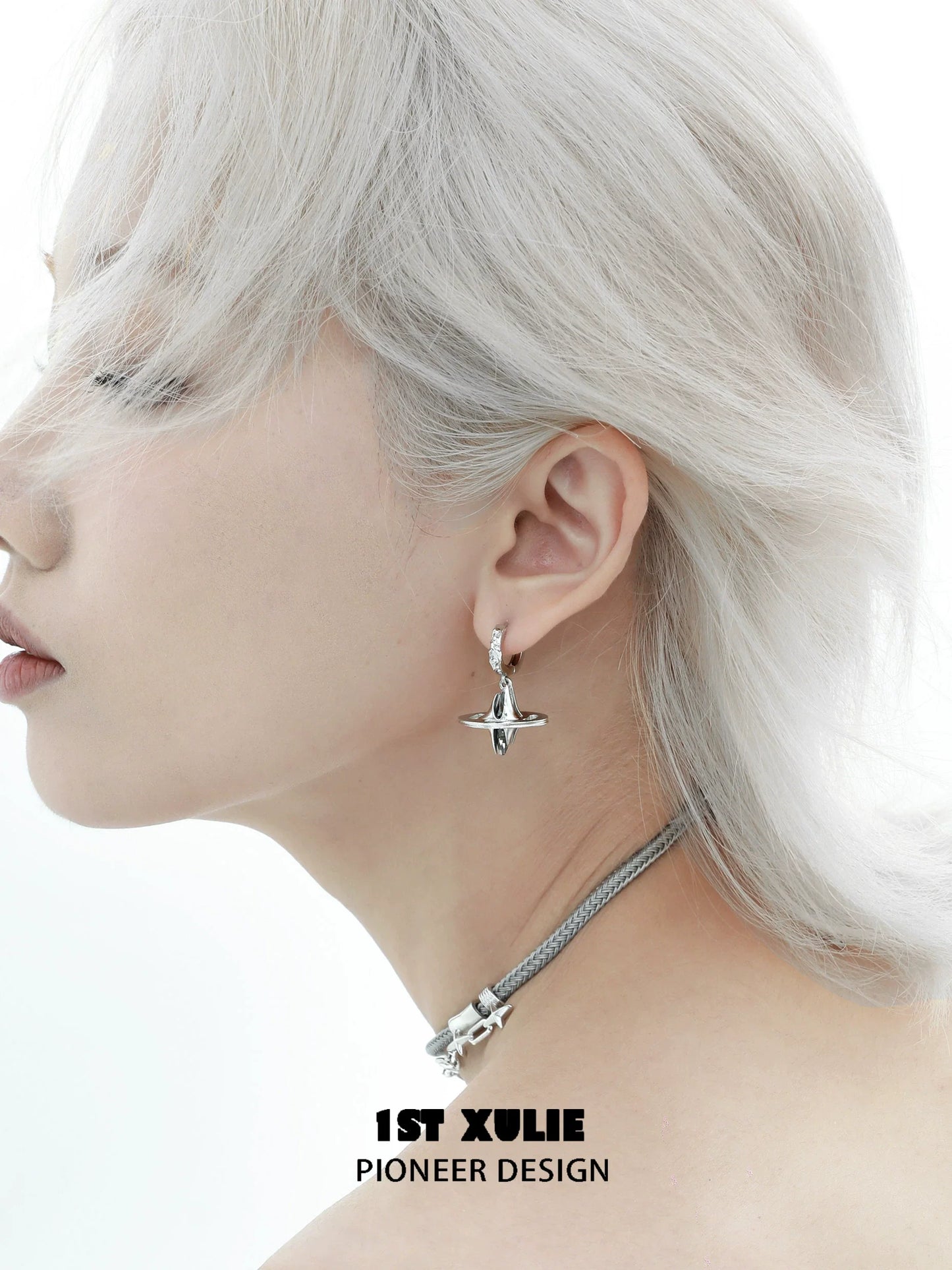 1ST XULIE Futuristic Dream Core Earrings with a unique design, worn by a model with silver hair