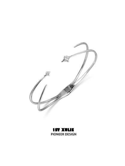 Futuristic silver bracelet with sleek design and sparkling star accents for modern fashion enthusiasts