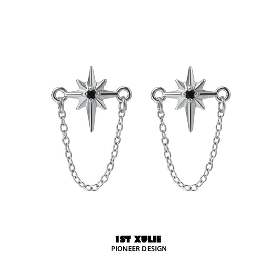 Futuristic star chain earrings in silver with striking star design and connecting chain