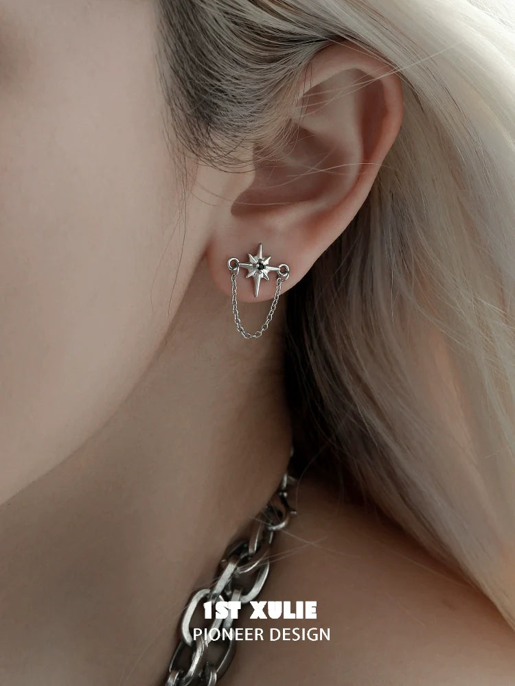 Futuristic star chain earrings by 1STXULIE showcasing a unique design with star accents and chains