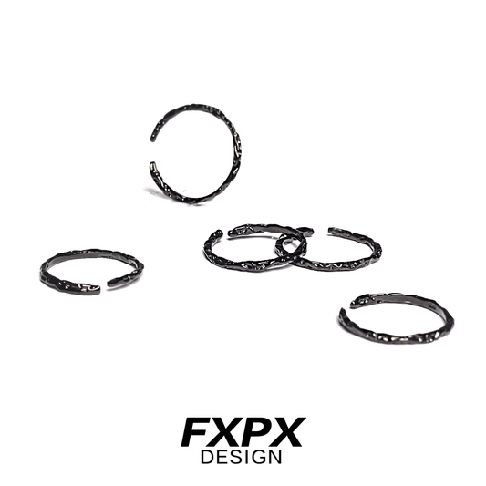 Set of FXPX black tinfoil texture rings with a unique and modern design for stylish accessorizing