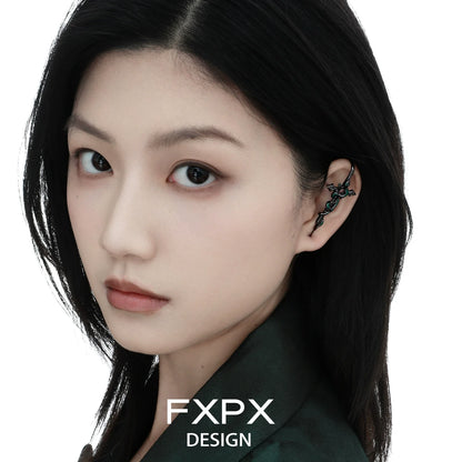 Bloody doll jewelry gothic snake pierced earrings worn on ear by model with black hair