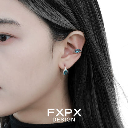 Bloody Doll Jewelry mystic iceland ear cuffs worn on a woman's ear with matching blue gemstone earrings
