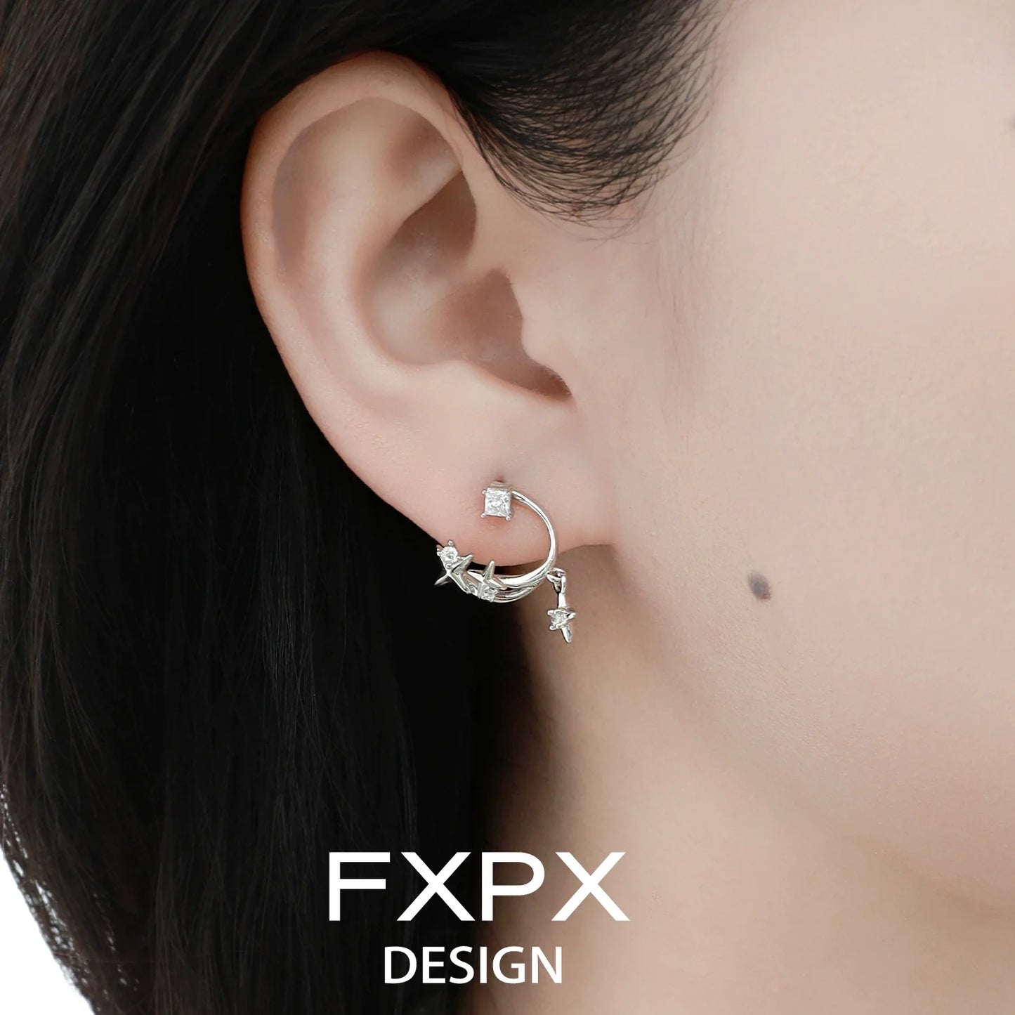 Bloody doll jewelry silver star constellation stud earrings worn on ear by model